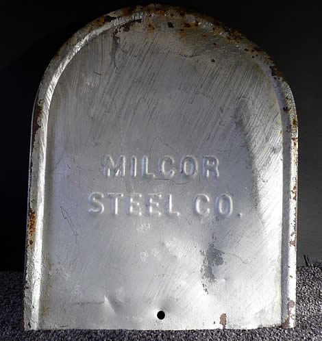 Back plate of the Claxton mailbox with resulting indentation on right side from impact upon interior