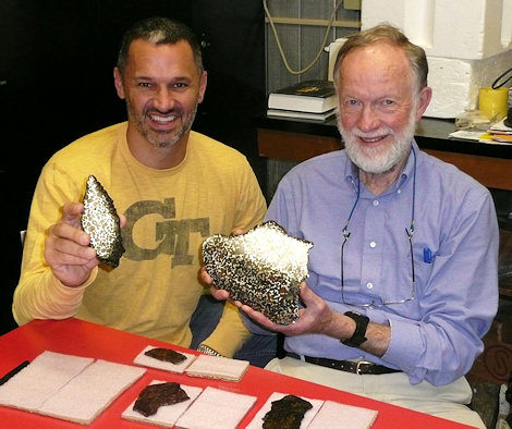 With Dr. John Wasson at UCLA, holding 103.81 and 298.38 gram complete slices, respectively