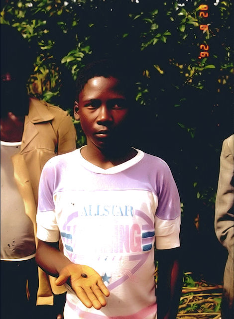 Boy hit by the 3gm specimen, displaying it in his hand