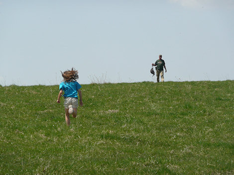 Maddie sprinting up a hill to greet Jack Schrader upon our arrival in the strewn field