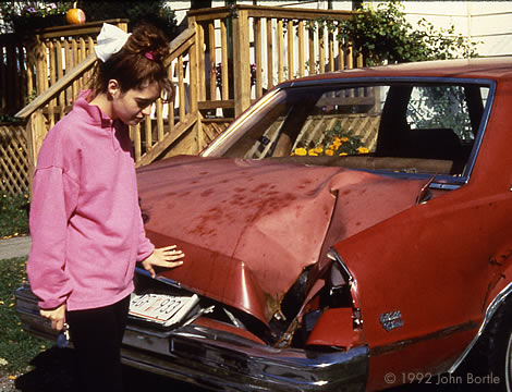 Photo of Michelle Knapp in the driveway with her Malibu taken by John Bortle only days after the historic impact.  Jerry Armstrong was kind enough to give me the original slide for this photo, which he had originally received from his friend, Mr. Bortle.  Mr. Bortle photographed this image and at least one more at the time, and he donated another slide to the Smithsonian Institution.  The rights to this image are owned by Mr. Bortle; if you are interested in a copy I will contact him to request permission.