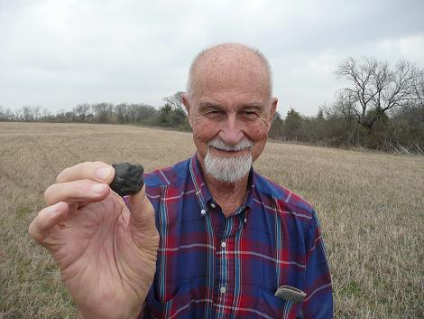 One of my favorite photos -- an image I took of Art Ehlmann on 3.8.9 with a freshly recovered specimen in the strewn field