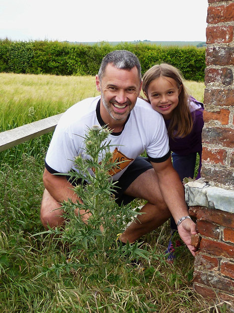 Holding the 133.2 gram corner section of brick in its original position with Maddie