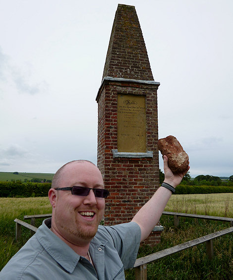 Martin Goff with a brick from base of original monument